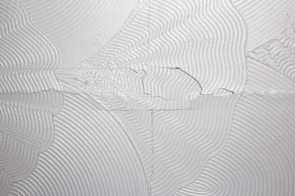 Artex ceiling cracking and breaking on the plaster board joins.