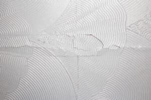 Artex ceiling cracking and breaking on the plaster board joins.